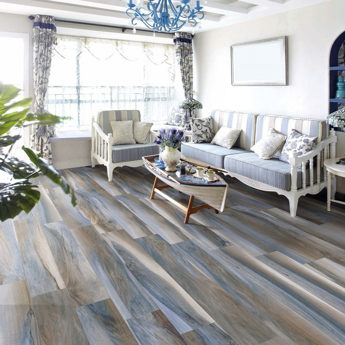 Amazzonia Blu matte porcelain tile with a blue wood design, for floors and walls. Made in Italy, installed in a room.