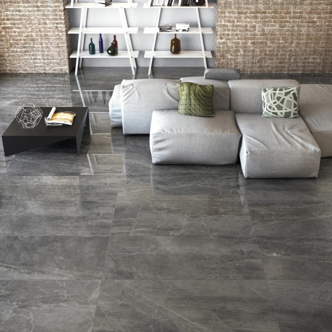 Athena Nero matte porcelain tile with a black stone design, for floors and walls. Made in Italy, installed in a room.