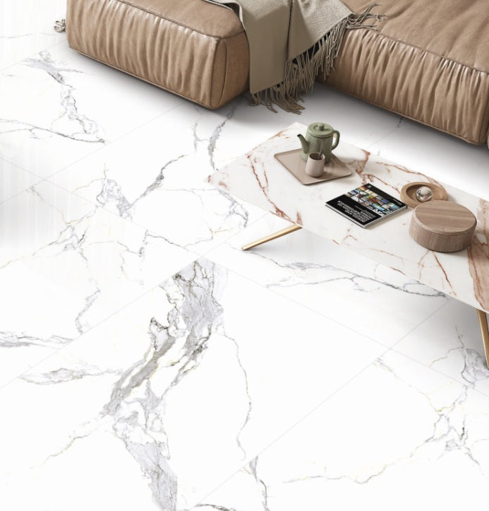 Bethany White polished porcelain tile with a white marble design, for floors and walls. Installed in a room.