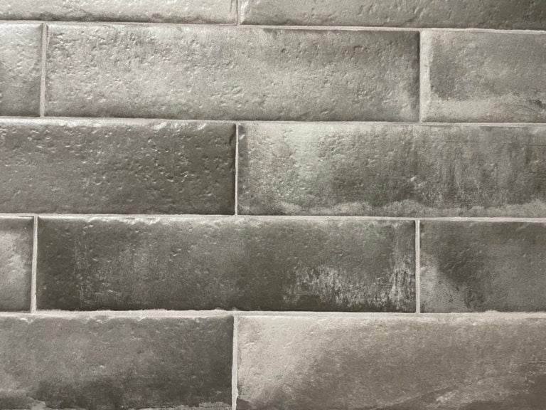 Brickell Antracita matte ceramic subway tile with an aged black style, for walls and backsplashes. In a 3x12" size.