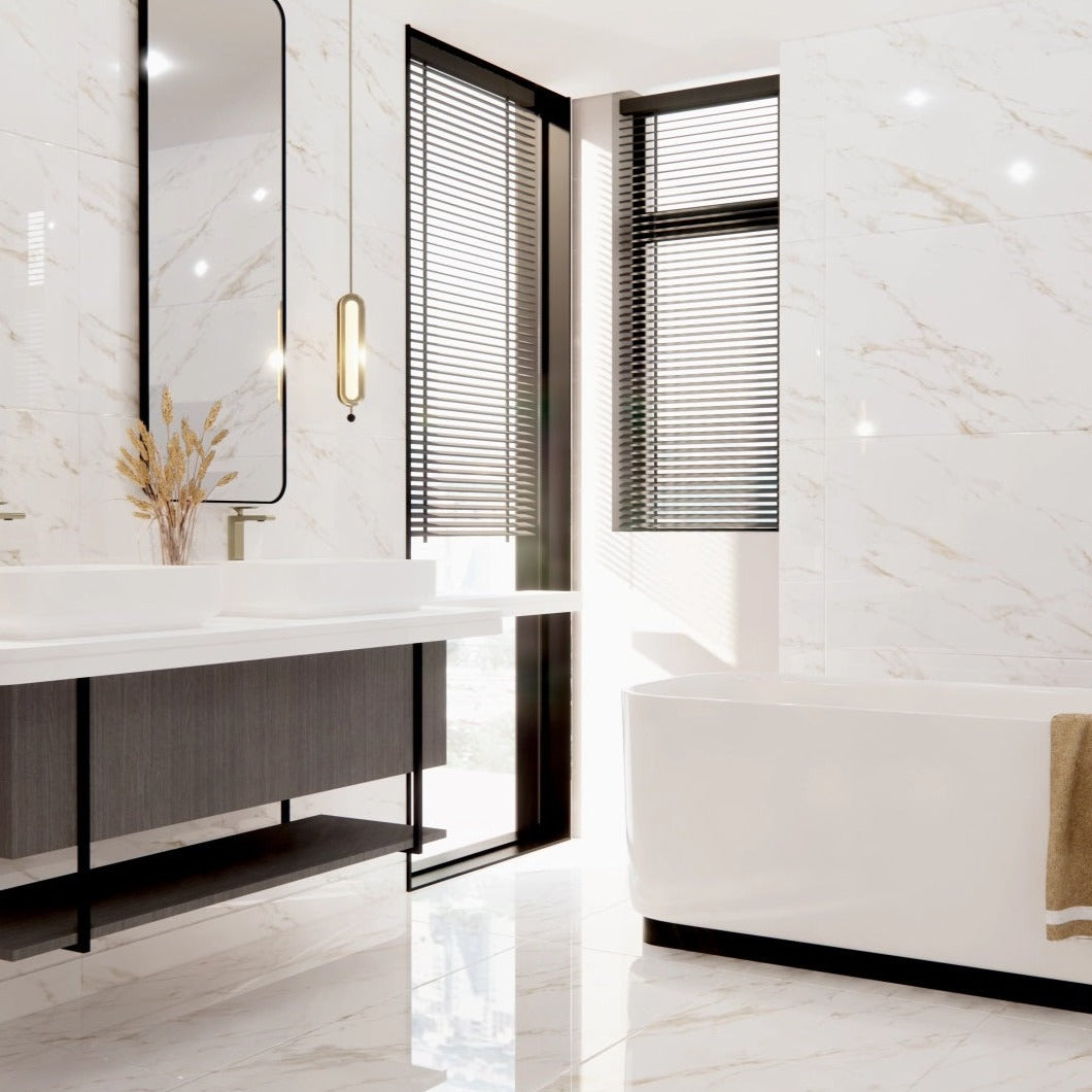Calacatta Gold porcelain tile with a white marble design, for floors and walls. Made in Spain, installed in a bathroom.