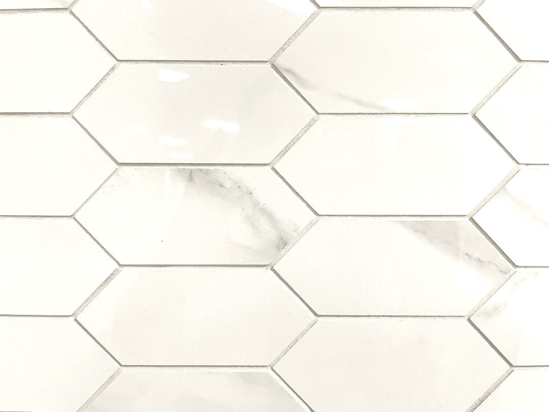 Carrara Simpatico polished porcelain mosaic with a white marble design, for floors and walls. In an elongated hexagon.