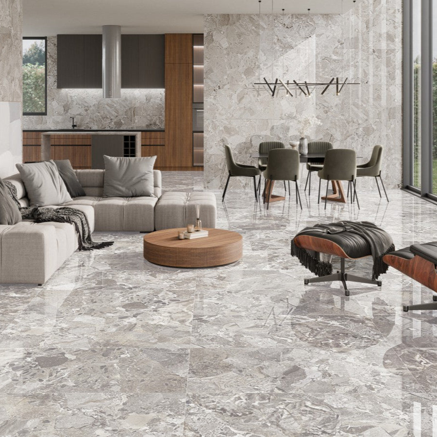 Ceppo White polished porcelain tile with a rock/pebble design, for floors and walls. Made in Spain, installed in a room.