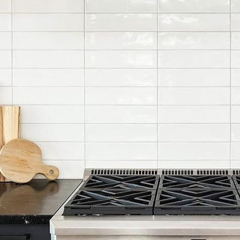 Dazzle Cloud glossy ceramic subway tile with a white wavy design, for walls. In a 3x12" size.