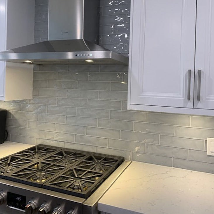 Dazzle Smoke glossy ceramic subway tile with a grey wavy design, for walls. In a 3x12" size.