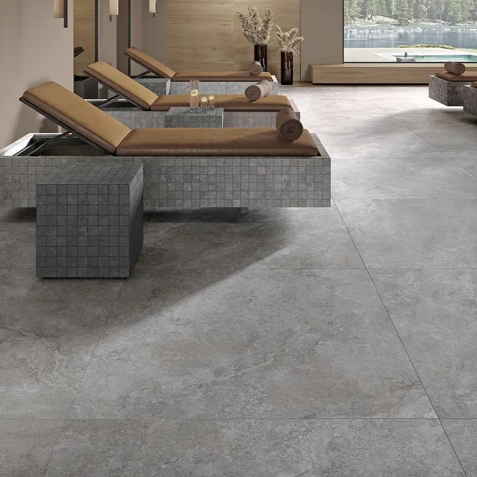 Dolomia Grey matte porcelain tile with a stone design, for floors and walls. Made in Italy, installed in a room.