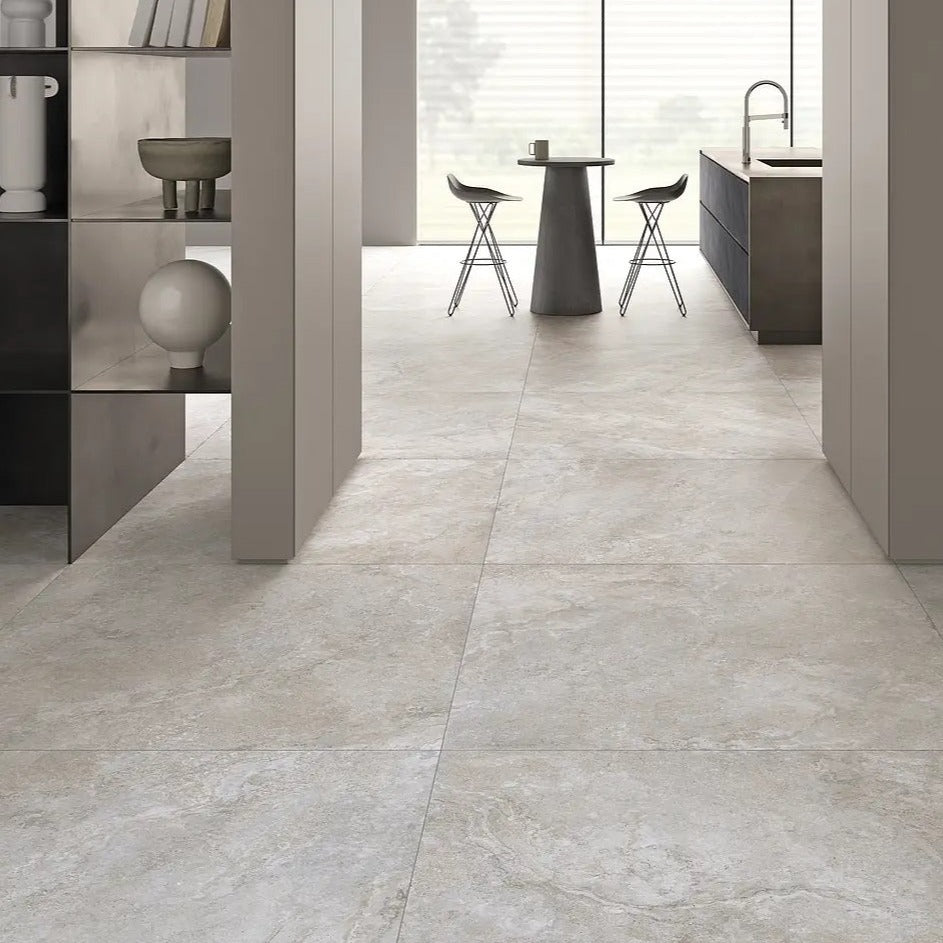Dolomia White matte porcelain tile with a stone design, for floors and walls. Made in Italy, installed in a room.
