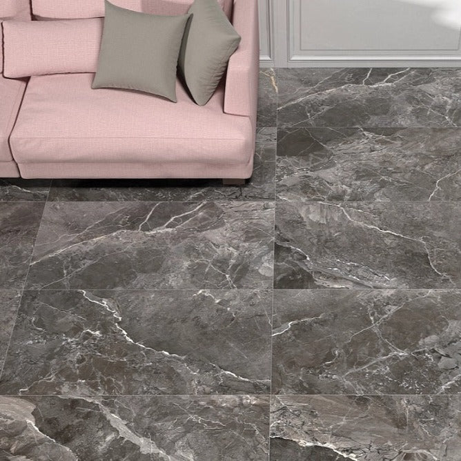 Earthstone Graphite glossy porcelain tile with a stone design, for floors and walls. Made in Spain, installed in a room.