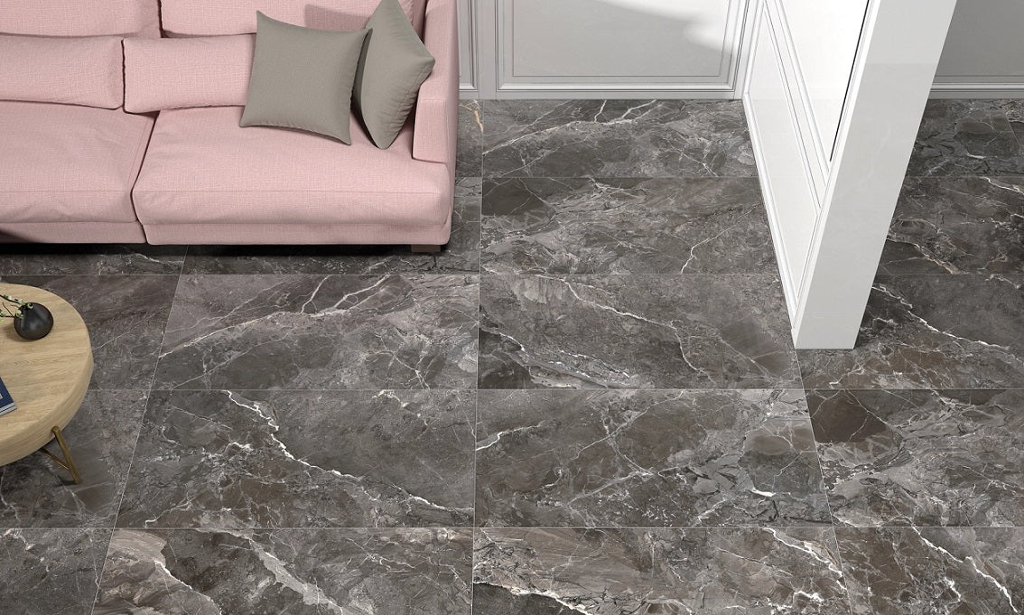Earthstone Graphite glossy porcelain tile with a stone design, for floors and walls. Made in Spain, installed in a room.