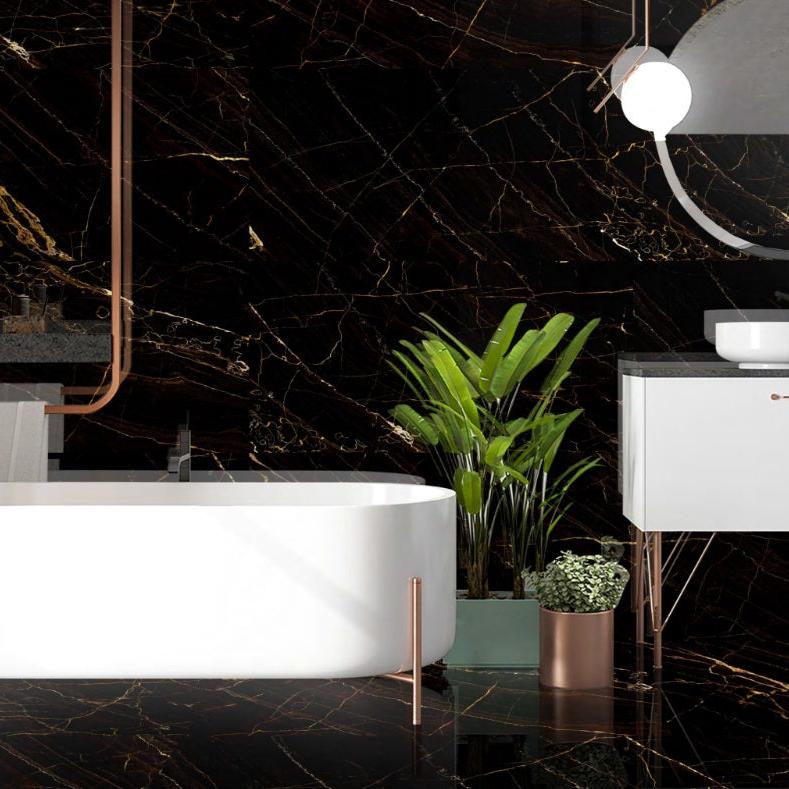 Esperada Black polished porcelain tile with a black and gold marble design, for floors and walls. Installed in a room.