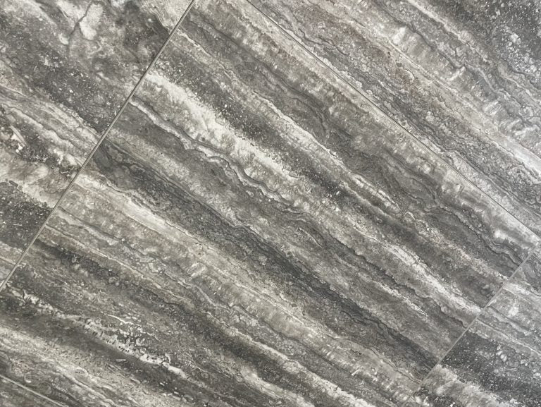 Ferrara Grey polished porcelain tile with a stone design, for floors and walls. In a 24x24" size.