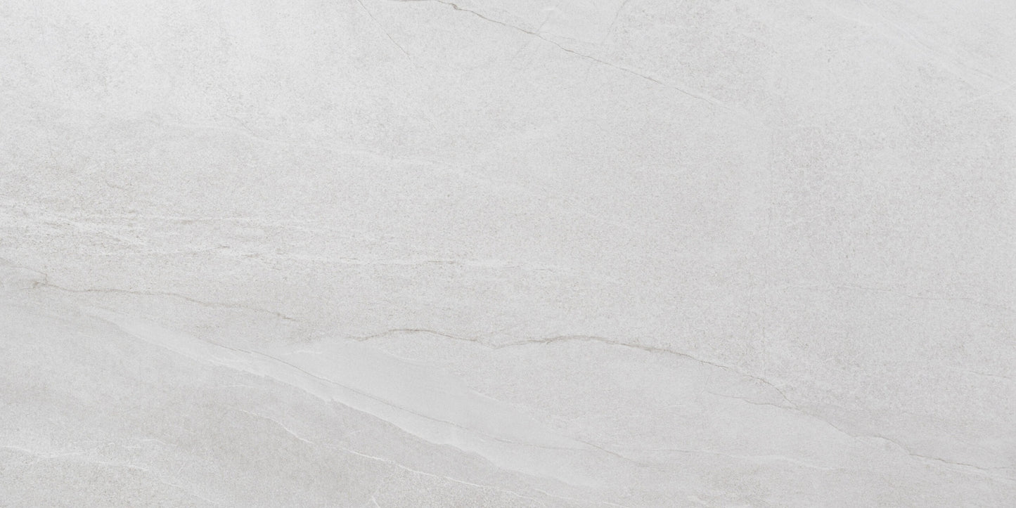 Halley White sugar porcelain tile with a white stone design, for floors and walls. Made in Spain, in a 24x48" size.