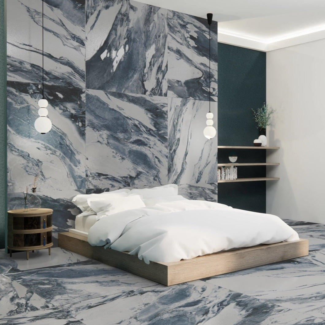 Lab Jeans Blue porcelain tile with a white marble design, for floors and walls. Made in Spain, installed in a room.