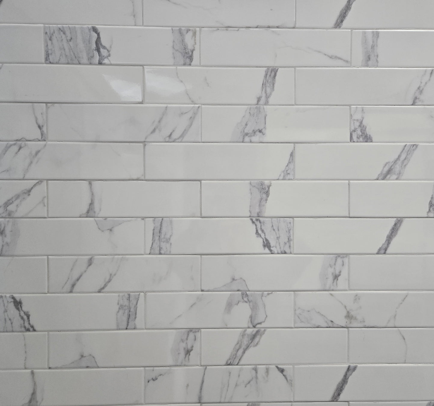 Calacata white marble style ceramic subway tile, for walls. Made in Spain, in a 3x12" size.