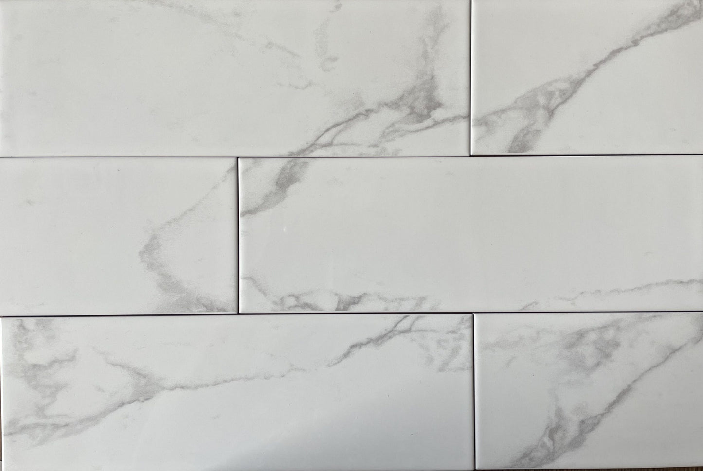 Liso Carrara white marble style ceramic subway tile, for walls. Made in Spain, in a 4x12" size.