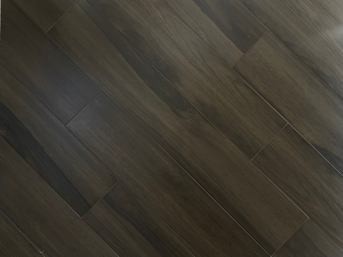 Loft Paradise matte porcelain tile with a dark brown wood design, for floors and walls. In a 6x36" size.