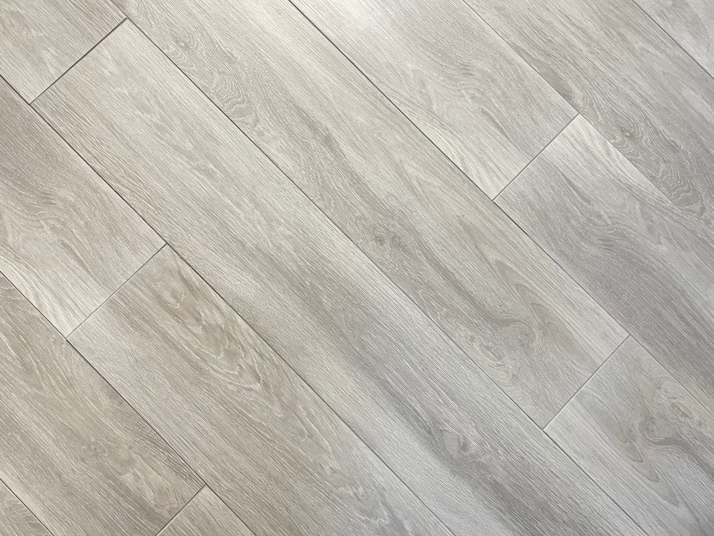Loft Tranquility matte porcelain tile with a light grey wood design, for floors and walls. In a 6x36" size.