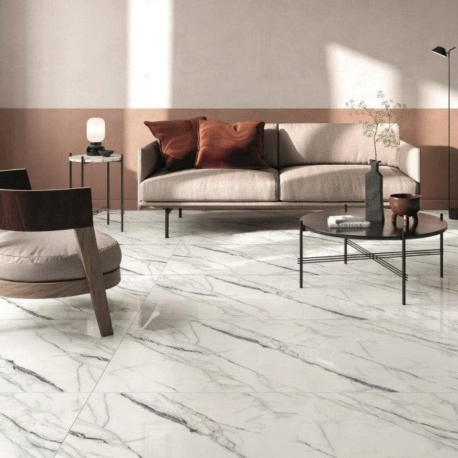 Marmo Carolina porcelain tile with a white and black marble style for floors and walls. Installed in a room.