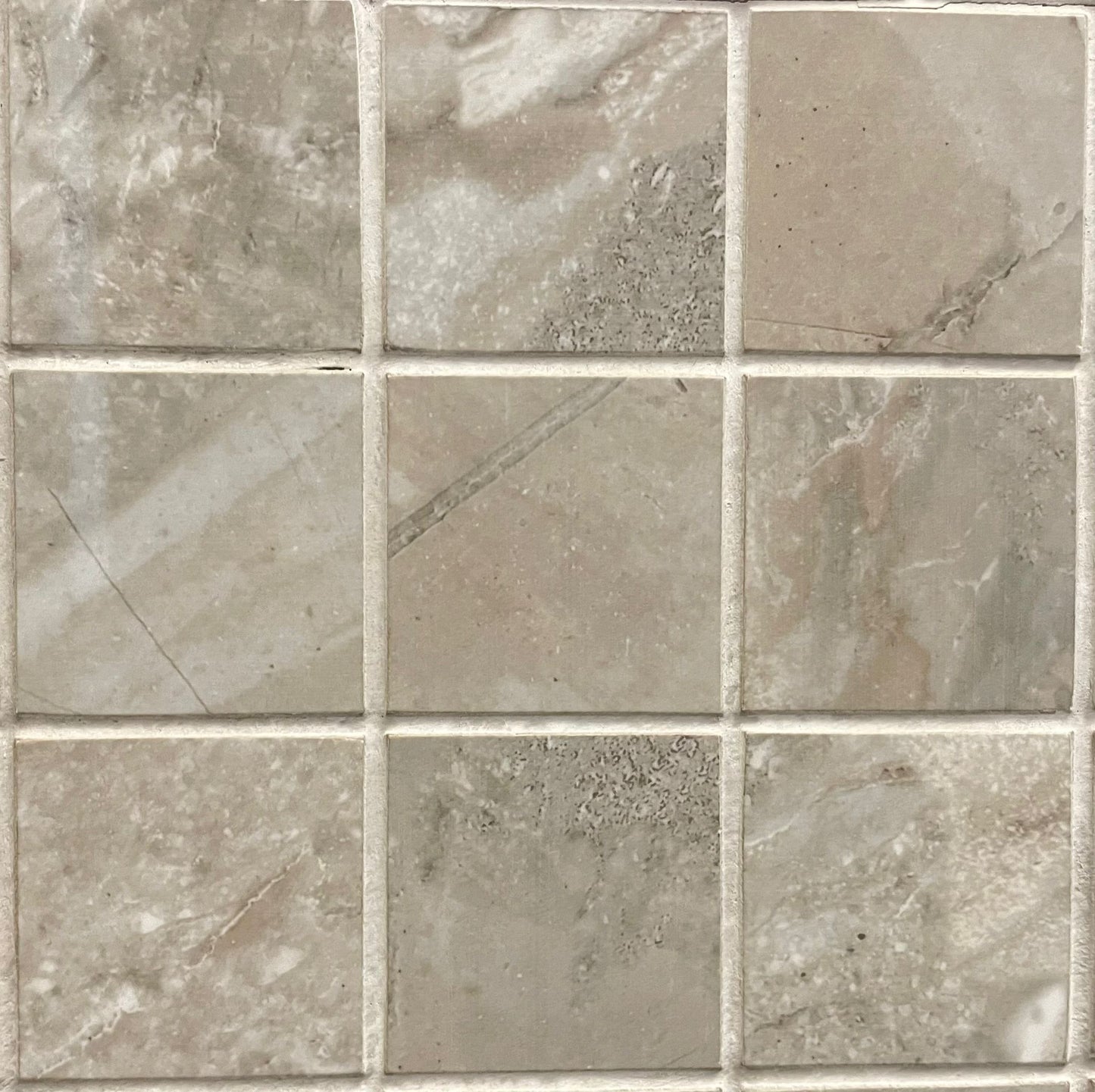 Coral Grey polished porcelain mosaic with a grey and brown marble style, for floors and walls. In a 2x2" size.