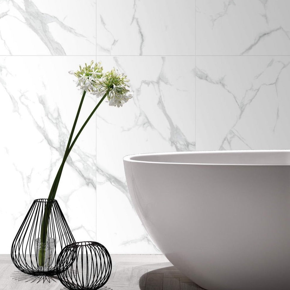 Marmo Gentilezza matte porcelain tile in a soft white marble style. Installed in a bathroom.