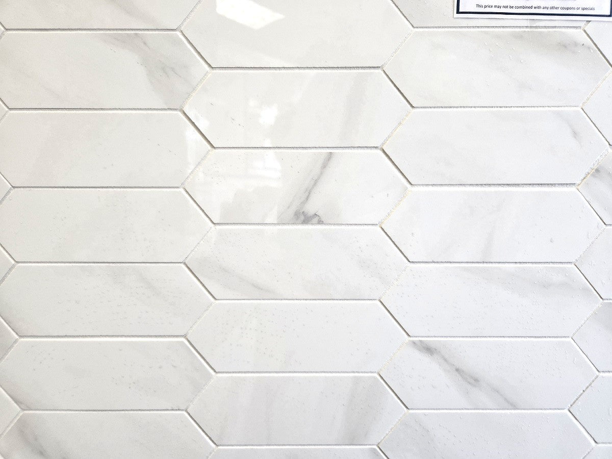 Marmo Isabella polished porcelain tile in a white marble style, for floors and walls. In an elongated hexagon mosaic.