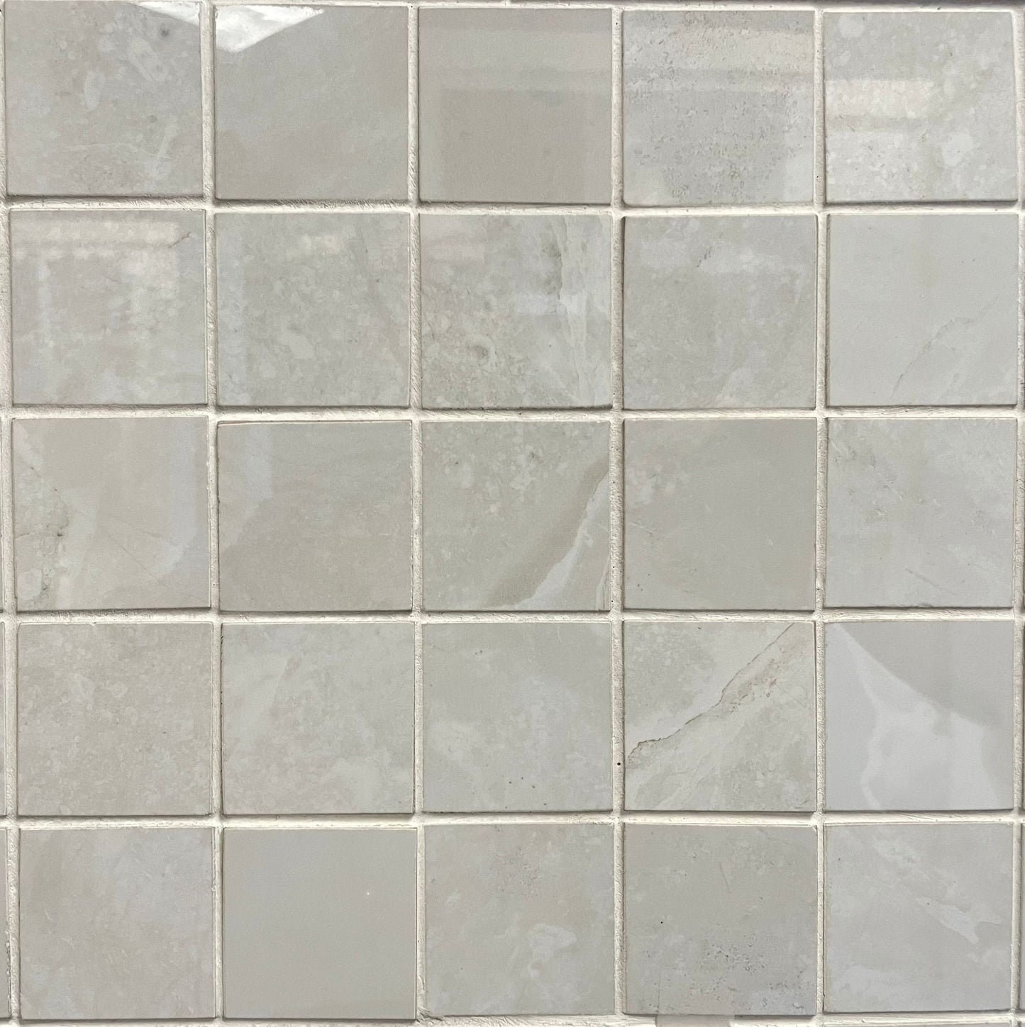 Onyx White polished porcelain mosaic with a white onyx style, for floors and walls. In a 2x2" size.