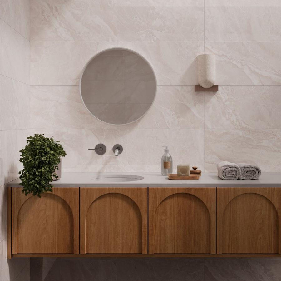 Marvinton Sand matte porcelain tile with a beige stone design, for floors and walls. Made in Spain, installed in a room.