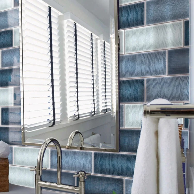 Mediterraneo Azul contemporary style glossy blue subway tile with varying designs. Installed on a vanity backsplash.