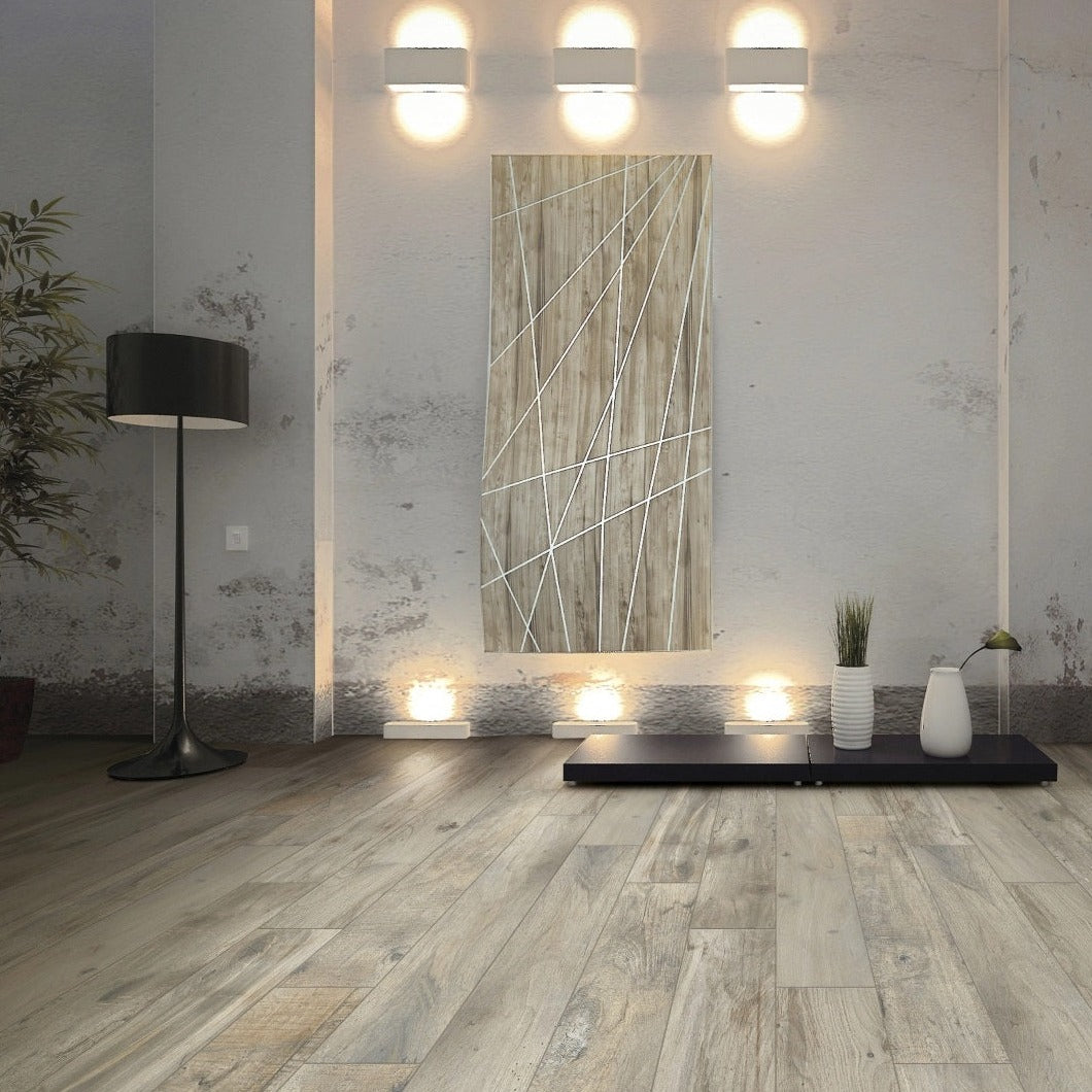 Memory Tortora matte porcelain tile with a taupe wood design, for floors and walls. Made in Italy, installed in a room.