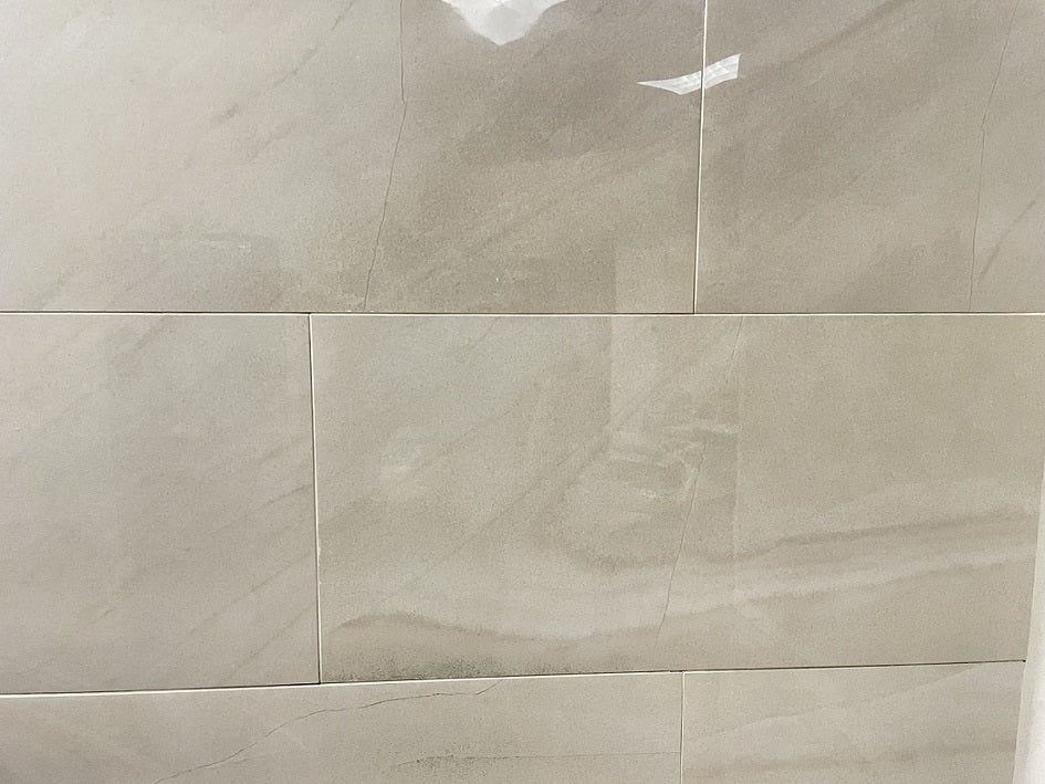 Moondust Kashmir polished porcelain tile with a beige marble style, for floors and walls. In a 12x24" size.