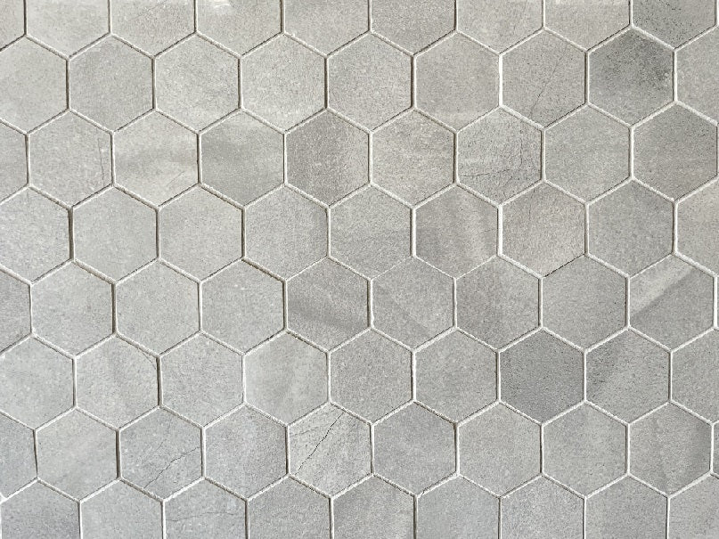 Moondust Mist polished porcelain mosaic with a grey marble style, for floors and walls. In a 2" hexagon size.