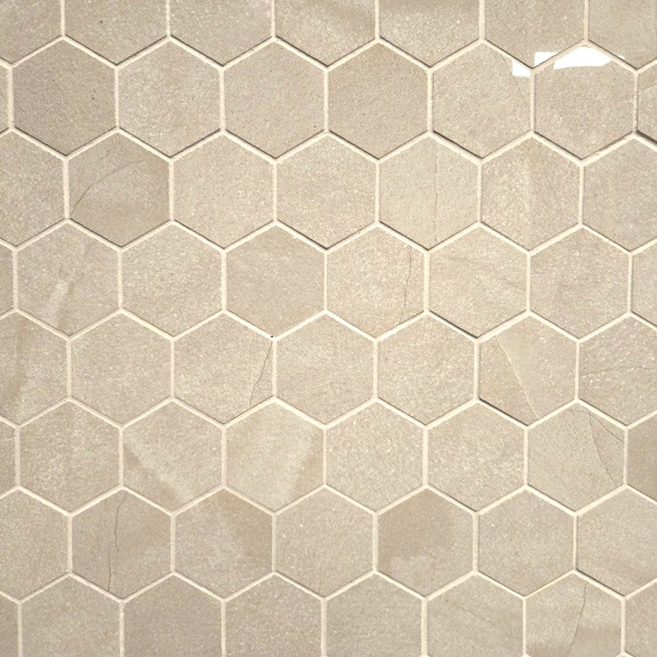 Moondust Sierra polished porcelain mosaic with a beige marble style, for floors and walls. In a 2" hexagon size.