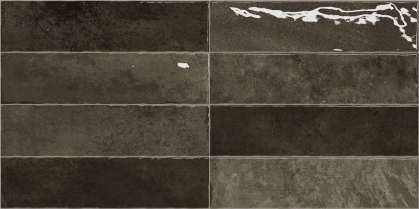 Nairobi Slate artisan style glossy ceramic subway tile with non-flat edge and surface. Made in Spain, in a 3x12" size.