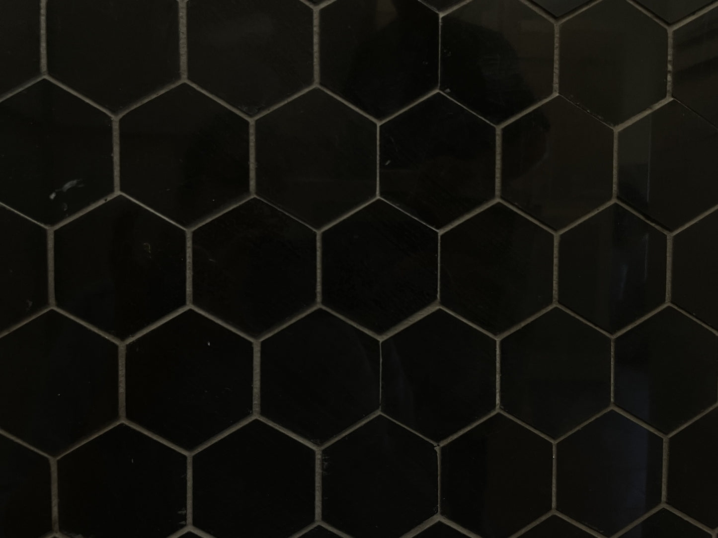 Nero Assoluto polished porcelain mosaic with a pure black colour, for floors and walls. In a small hexagon shape.