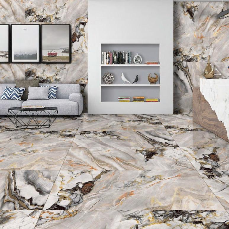 Paco Pearl polished porcelain tile with a grey and gold stone/mable design, for floors and walls. Installed in a room.