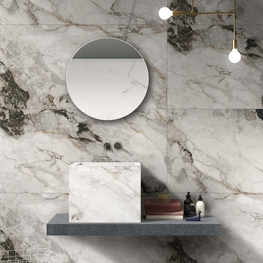 Pandora polished porcelain tile with a white, gold and black marble style for floors and walls. Installed in a room.