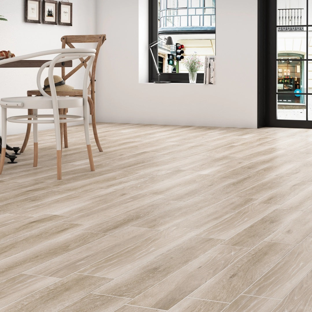 Pecan Taupe matte porcelain tile with a wood design, for floors and walls. Made in Spain, installed in a room.