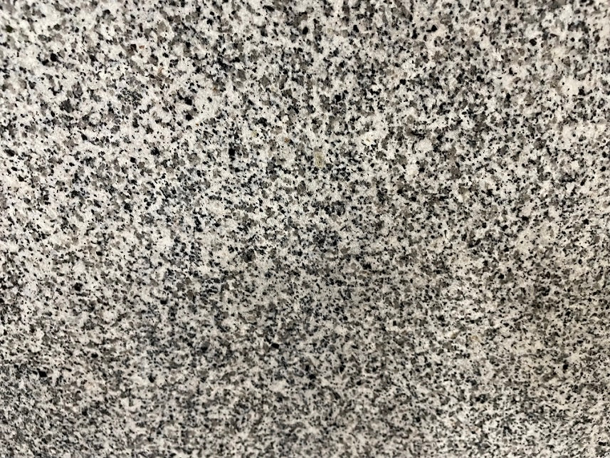 Pedang Light polished granite tile with a white and black style, for floors and walls. In a 12x24" size.