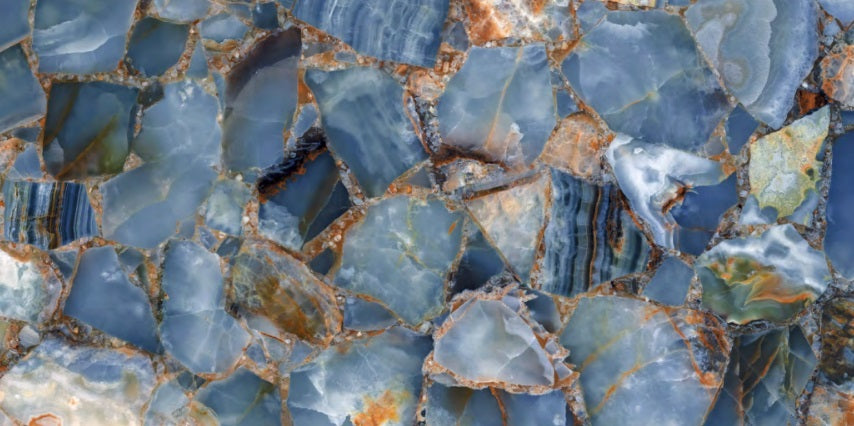 Plaque Aqua polished porcelain tile with a blue agate design, for floors and walls. In a 24x48" size.