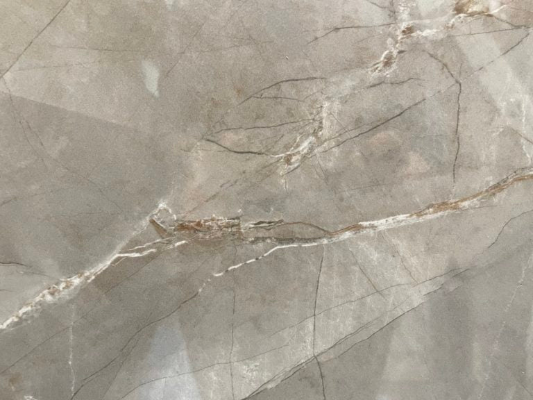 Pulpis Tobacco polished porcelain tile with a marble design, for floors and walls. Made in Italy, in a 14x28" size.