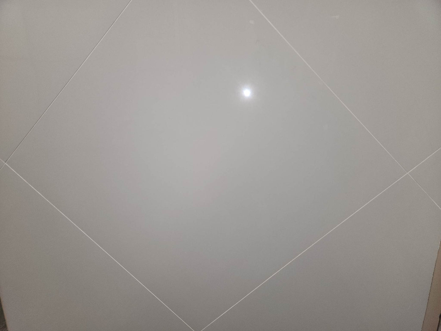 Pure White polished porcelain tile for floors and walls. In a 24x24" size.