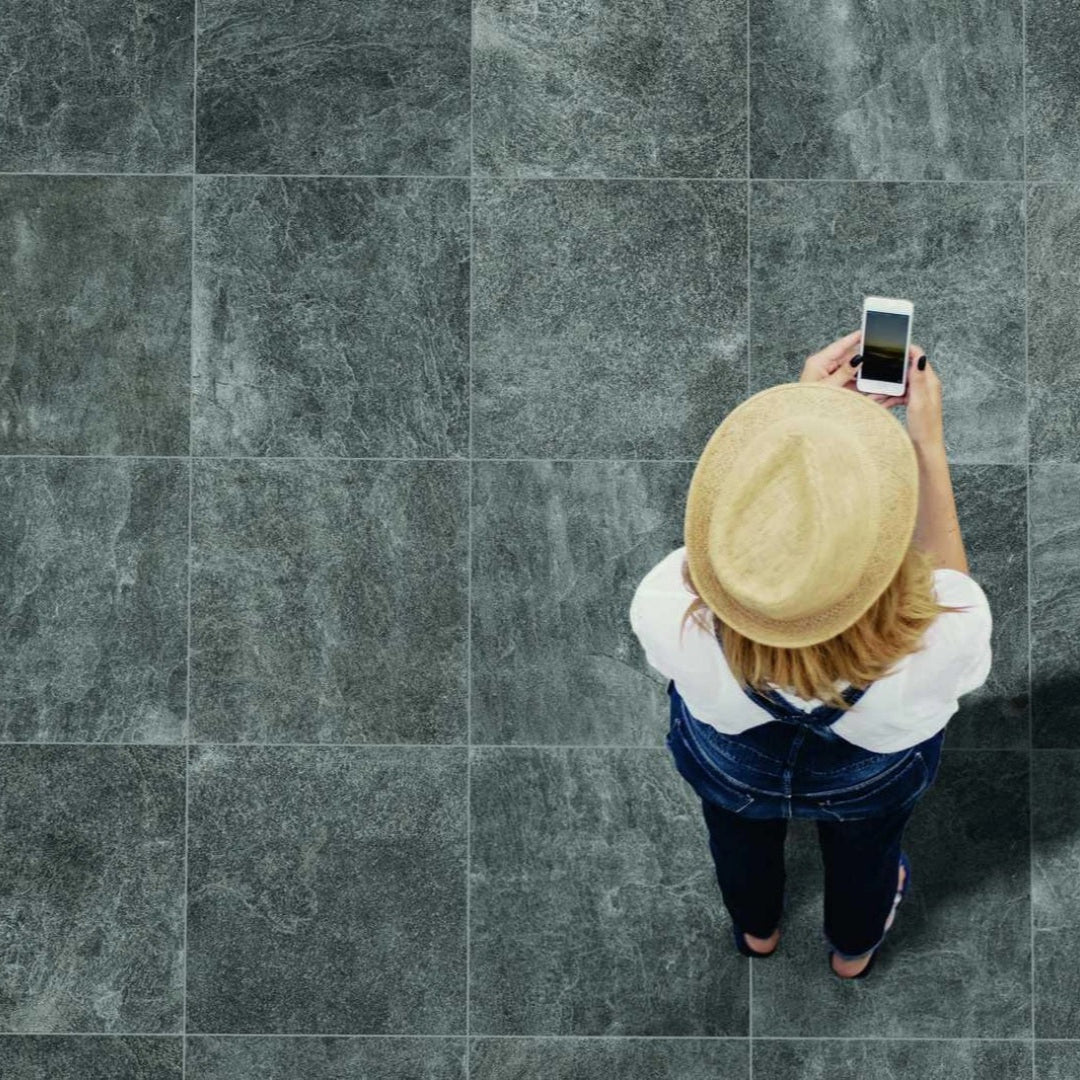 Rocking Anthracite matte porcelain tile with a stone design, for floors and walls. Made in Italy, installed outside.