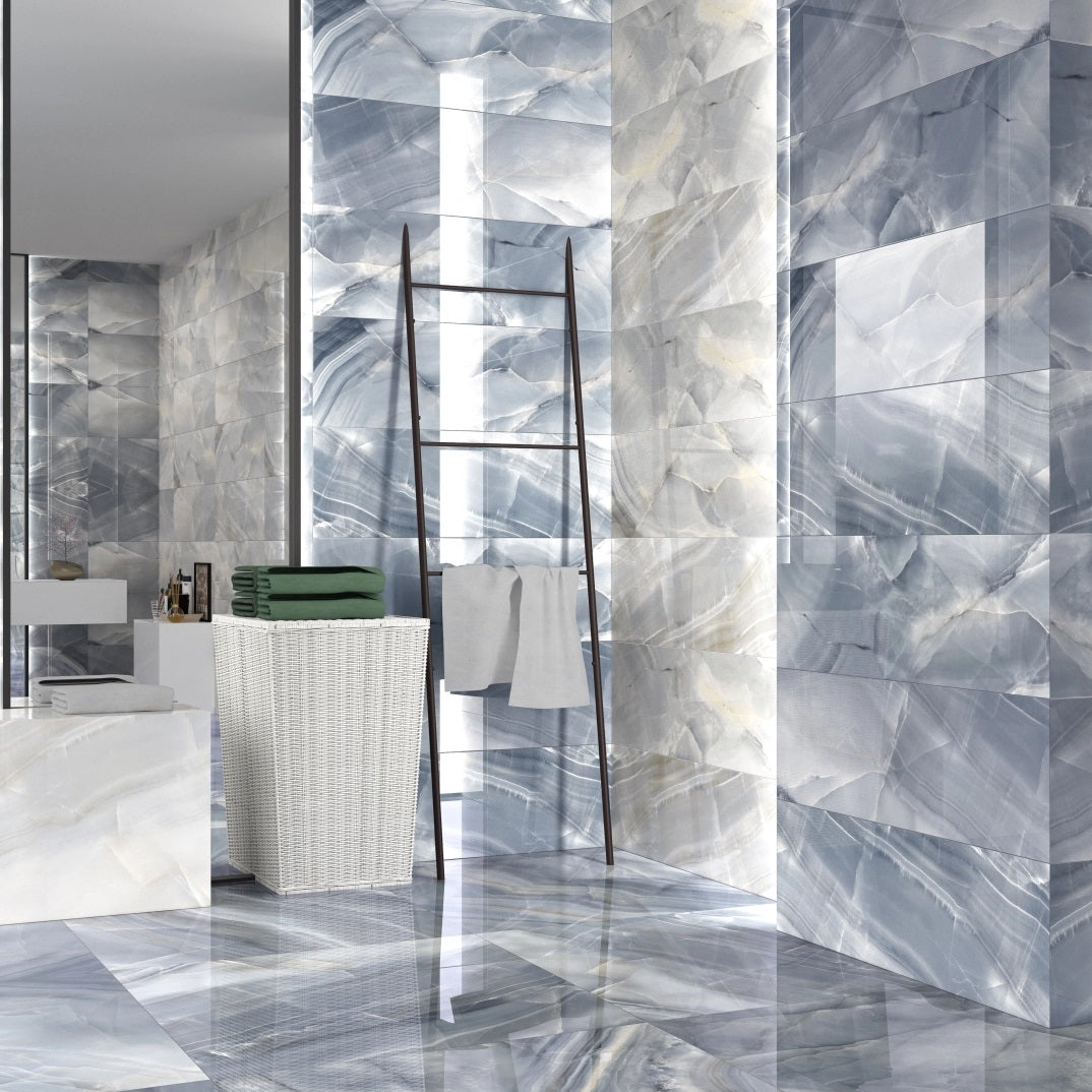Rodas Smerato polished porcelain tile with a blue onyx design, for floors and walls. Made in Spain, installed in a room.