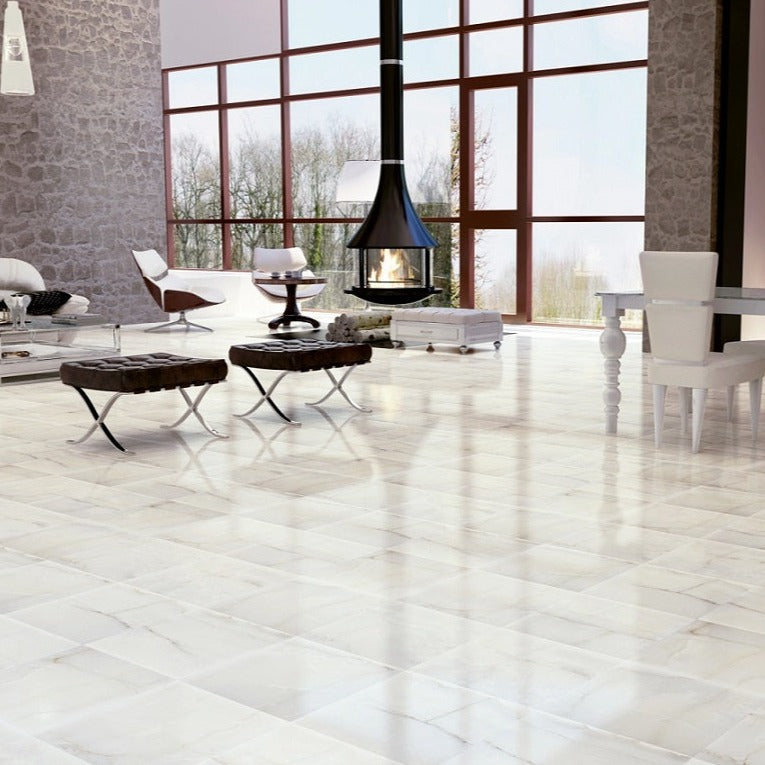 Roma polished porcelain tile with a beige marble design, for floors and walls. Made in Spain, installed in a room.