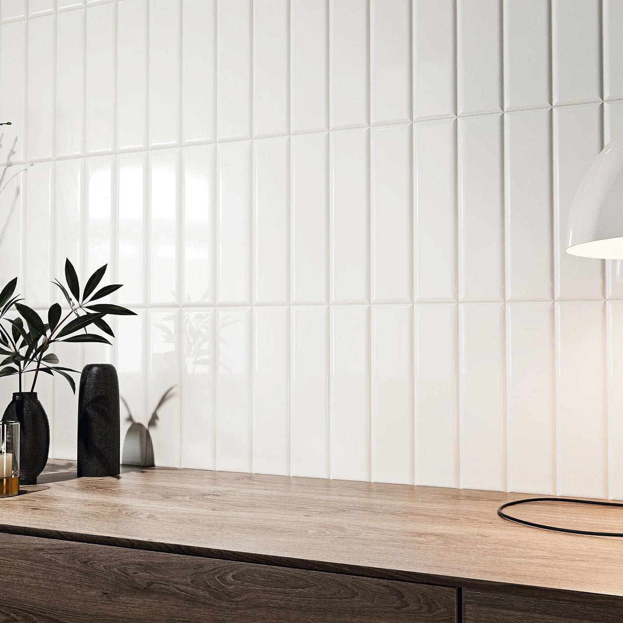 Romo Blanco white glossy ceramic subway tile with a rounded beveled edge, for walls. Installed on a backsplash.