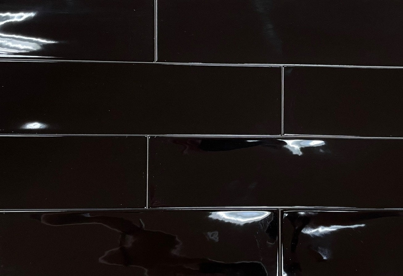 Selkis Black glossy ceramic subway tile with a black solid colour, for walls. Made in Spain, in a 3x12" size.