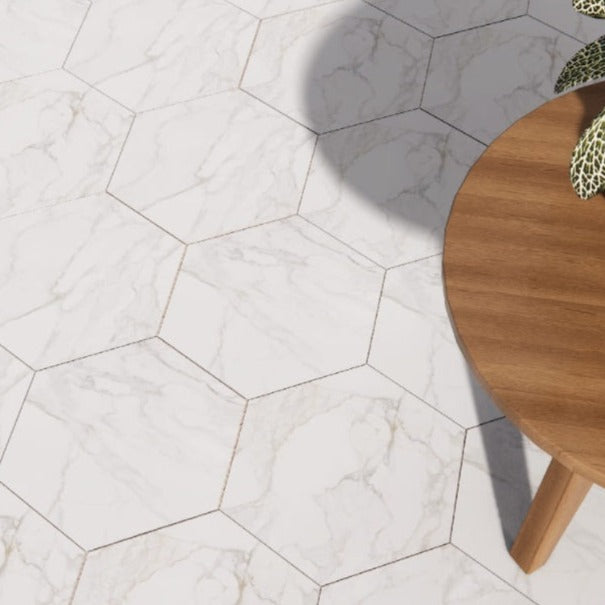 Paonazzo Gold hexagon matte porcelain tile for floors and walls. Made in Spain, installed in a room.
