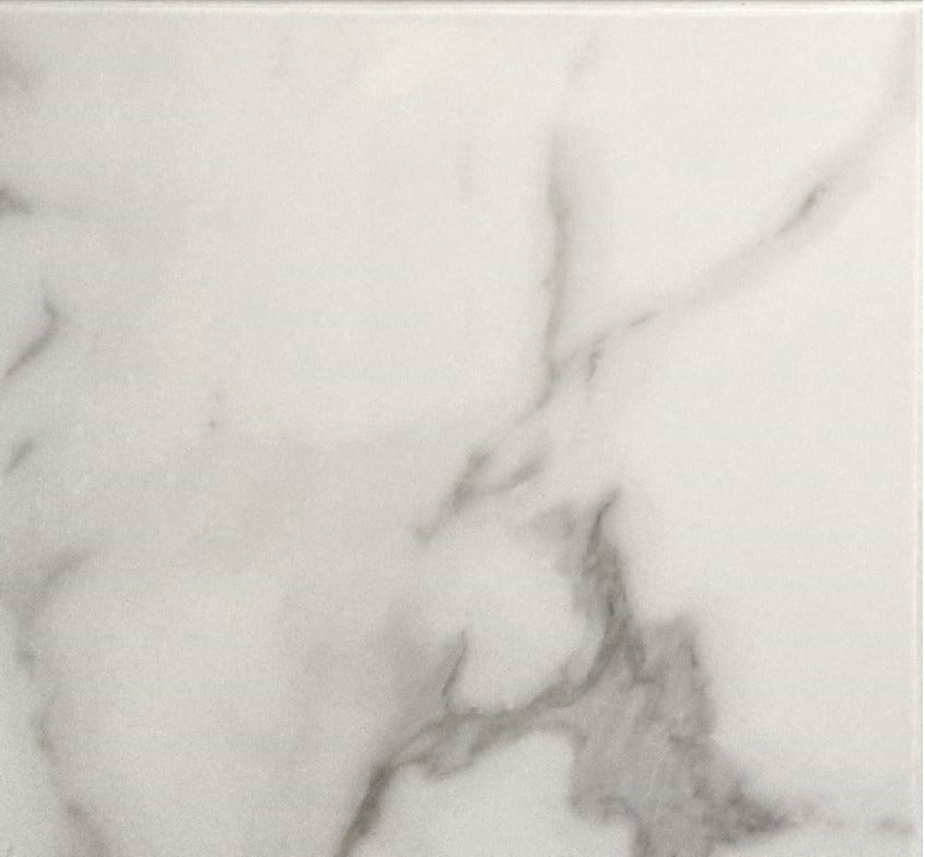 Statuario glossy ceramic tile with a white marble design, for floors and walls. Made in Spain, in a 18x18" size.