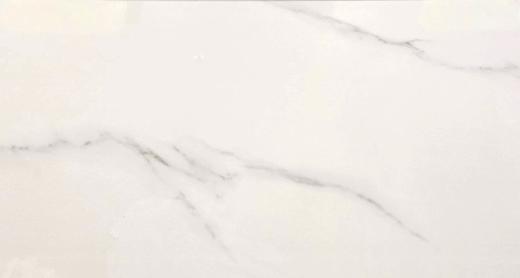 Statuario Argentum polished porcelain tile with a white marble effect, for floors and walls. In a 30x60" size.