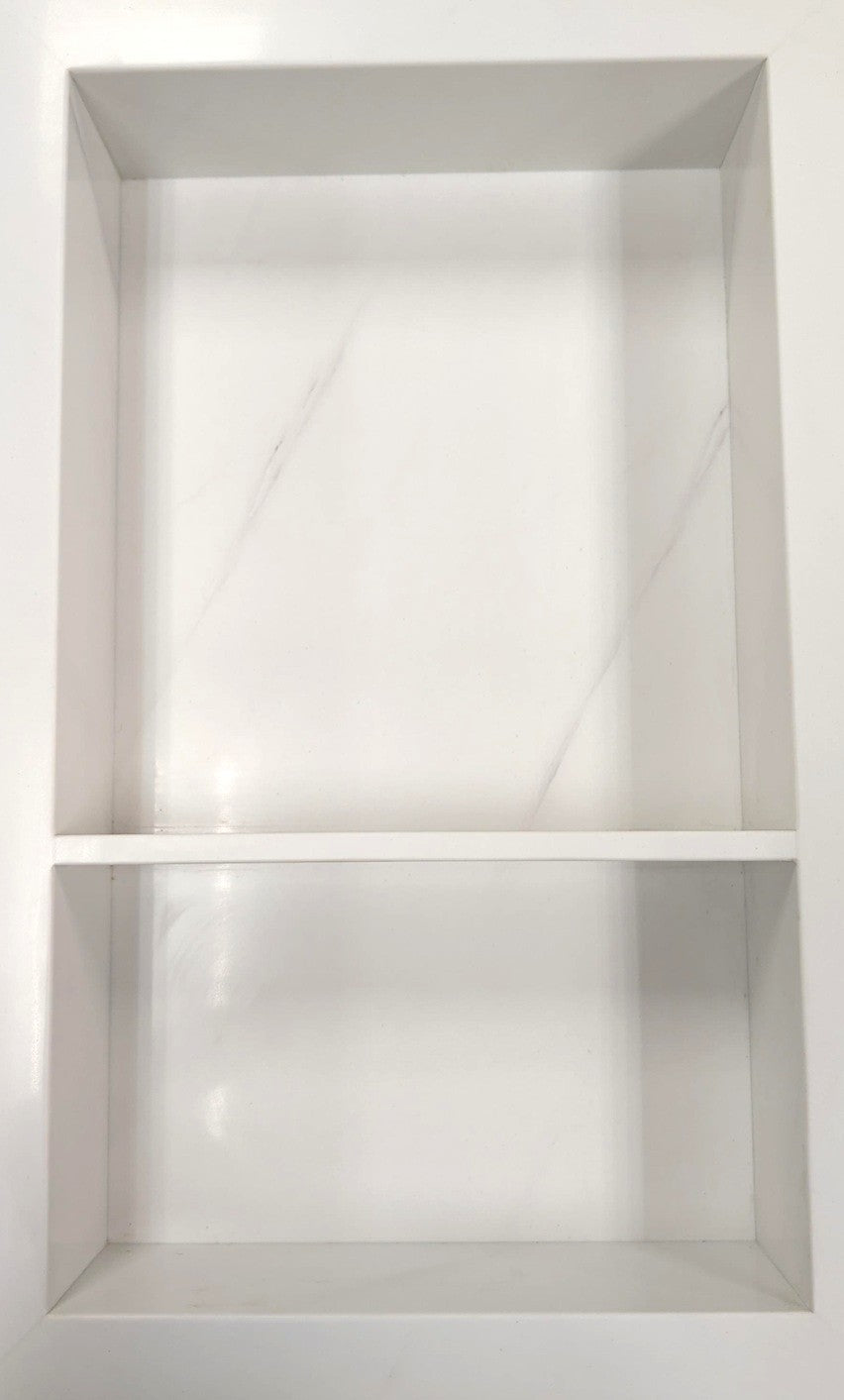 Statuario prebuilt quartz shower niche made of engineered stone that offers shower storage, with a shelf.